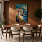 This impasto style framed canvas depicts the Amalfi Coast featuring a cluster of Italian villas with terracotta roofs perched on cliffs overlooking a vibrant blue Mediterranean sea under a partly cloudy sky, with colorful flowers in the foreground enhancing the coastal landscape scene.