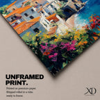 This impasto style framed canvas depicts the Amalfi Coast featuring a cluster of Italian villas with terracotta roofs perched on cliffs overlooking a vibrant blue Mediterranean sea under a partly cloudy sky, with colorful flowers in the foreground enhancing the coastal landscape scene.