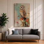 A detailed vintage-style framed canvas art print depicting a barn owl perched on a branch surrounded by wildflowers. The artwork features a rustic, naturalistic approach with soft textures and muted colors, capturing the essence of wildlife and farmhouse charm in a classic animal portrait style.