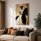 A framed painting of a woman dressed in a white dress and wide-brimmed hat riding a black horse. The artwork features a realistic style with warm beige and brown tones in the background, emphasizing the elegant posture of the rider and the horse’s strong presence.