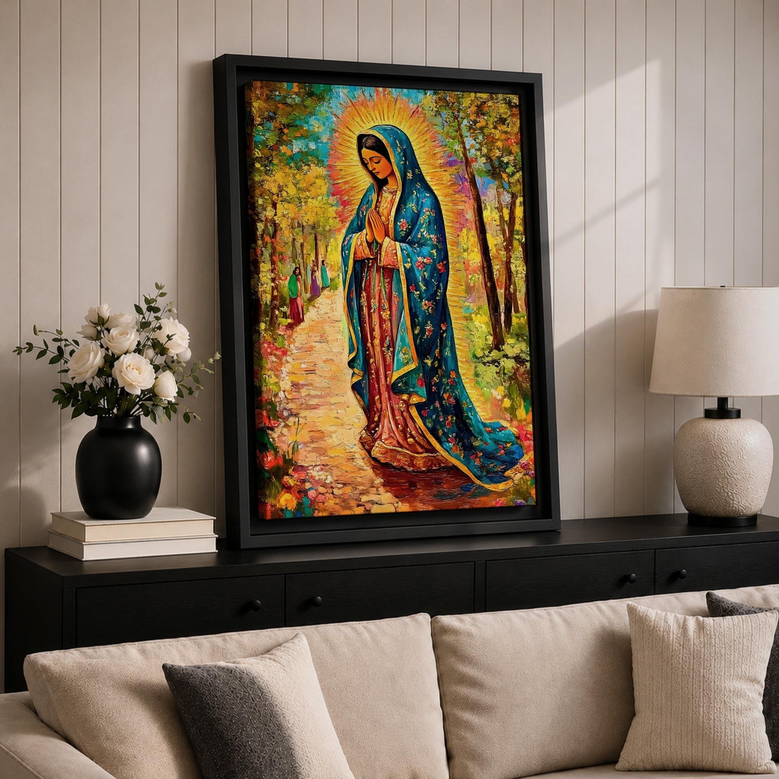 Illustration of the Lady of Guadalupe also known as La Virgen Morena standing with hands clasped in prayer, wearing a rose colored gown and a teal mantle covered with gold stars, surrounded by radiant golden rays and decorative floral elements with a small angel beneath her, rendered with warm tones and soft shading in Mexican Catholic devotional style.