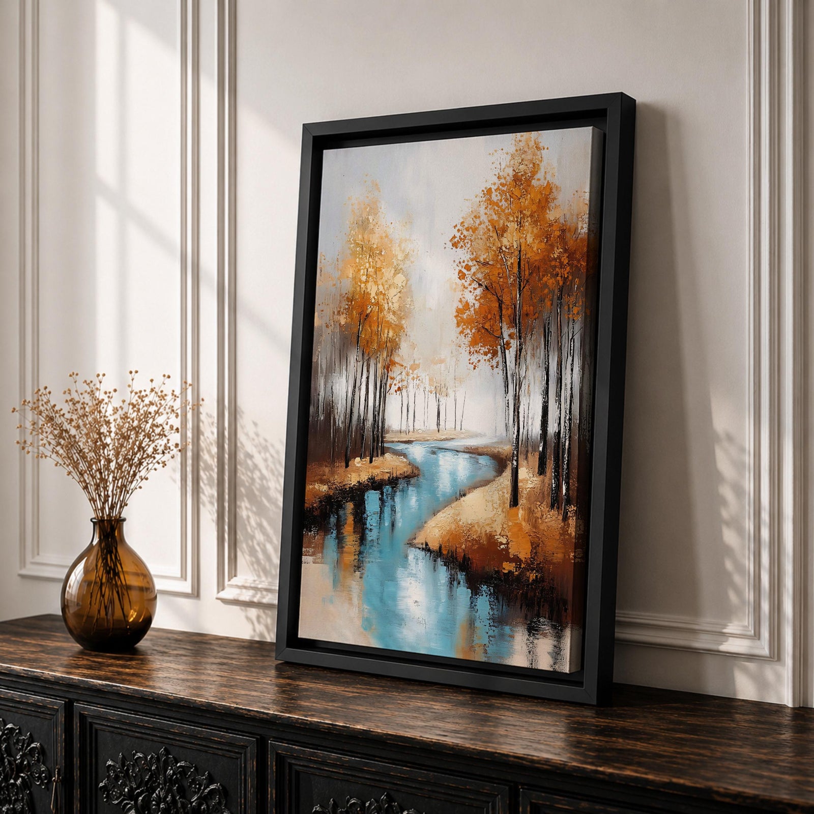 A framed canvas painting depicting an autumn river winding through a forest with tall trees in fall colors. The artwork features a vintage style with textured brushstrokes, emphasizing the natural landscape and serene water reflections in warm rustic tones.