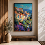This impasto style painting depicts a vibrant Mediterranean village with terracotta-roofed houses clustered on a hillside surrounded by lush greenery and colorful flowers, set against a bright blue sky and distant mountains, capturing the charm and warmth of a coastal landscape.