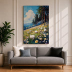 This impasto style framed canvas depicts a scenic landscape of sheep grazing in a meadow filled with wildflowers, bordered by tall trees and distant mountains under a bright blue sky with fluffy clouds, rendered with thick textured brushstrokes that emphasize the natural rustic setting.