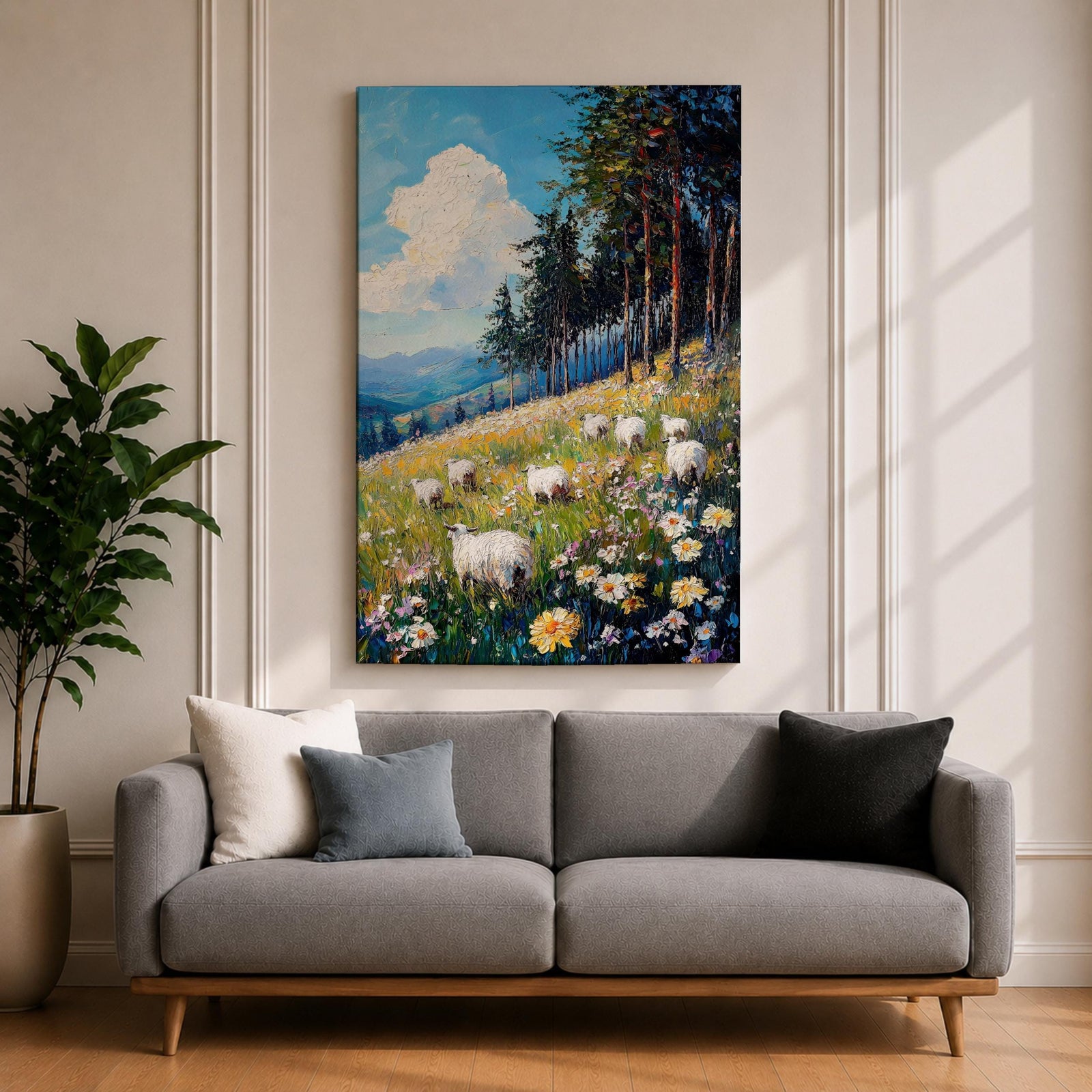 This impasto style framed canvas depicts a scenic landscape of sheep grazing in a meadow filled with wildflowers, bordered by tall trees and distant mountains under a bright blue sky with fluffy clouds, rendered with thick textured brushstrokes that emphasize the natural rustic setting.
