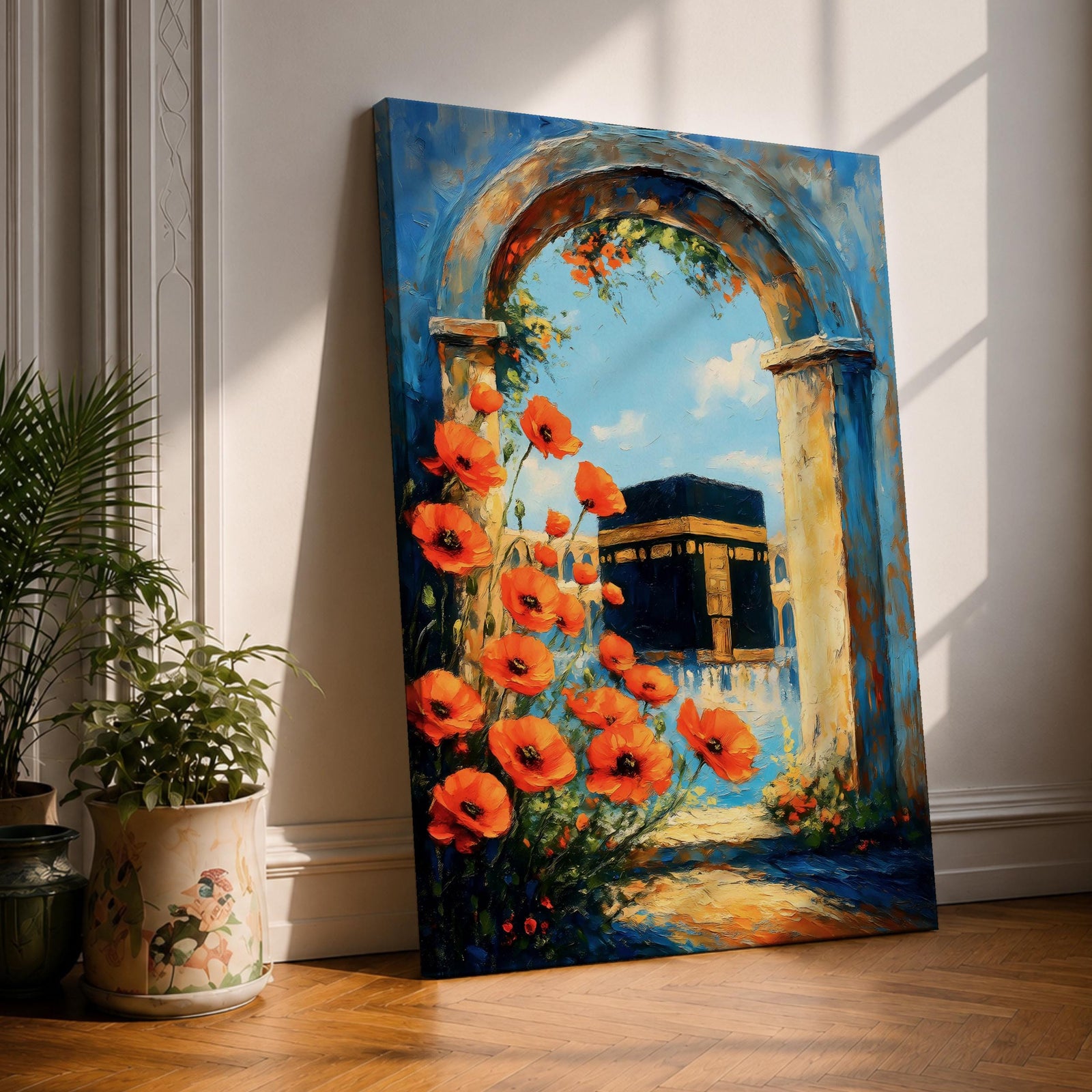 A vibrant painting depicting the Kaaba framed by an ancient stone arch adorned with bright orange flowers. The artwork captures the iconic Islamic holy site with a clear blue sky background, rendered in a realistic style emphasizing architectural and floral details.