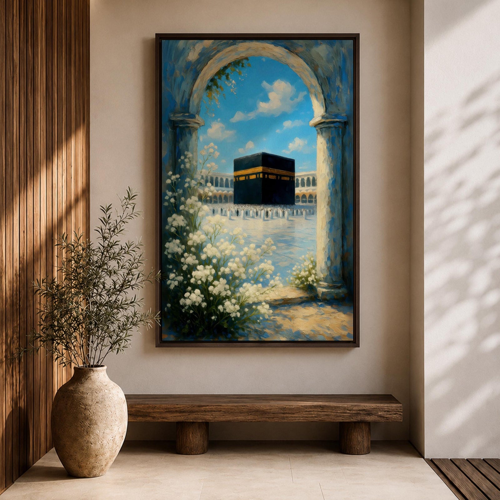 A watercolor painting depicting the Kaaba framed by a floral arch with white blossoms and stone columns, set against a bright blue sky with soft clouds, capturing the iconic Islamic holy site in Mecca with delicate brushwork and vibrant colors.
