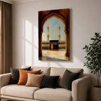 A watercolor style framed canvas depicting the Kaaba viewed through an arched gateway, showing the black cube structure with golden door and surrounding mosque minarets under a clear sky with flying birds, rendered in warm tones and detailed architectural elements.