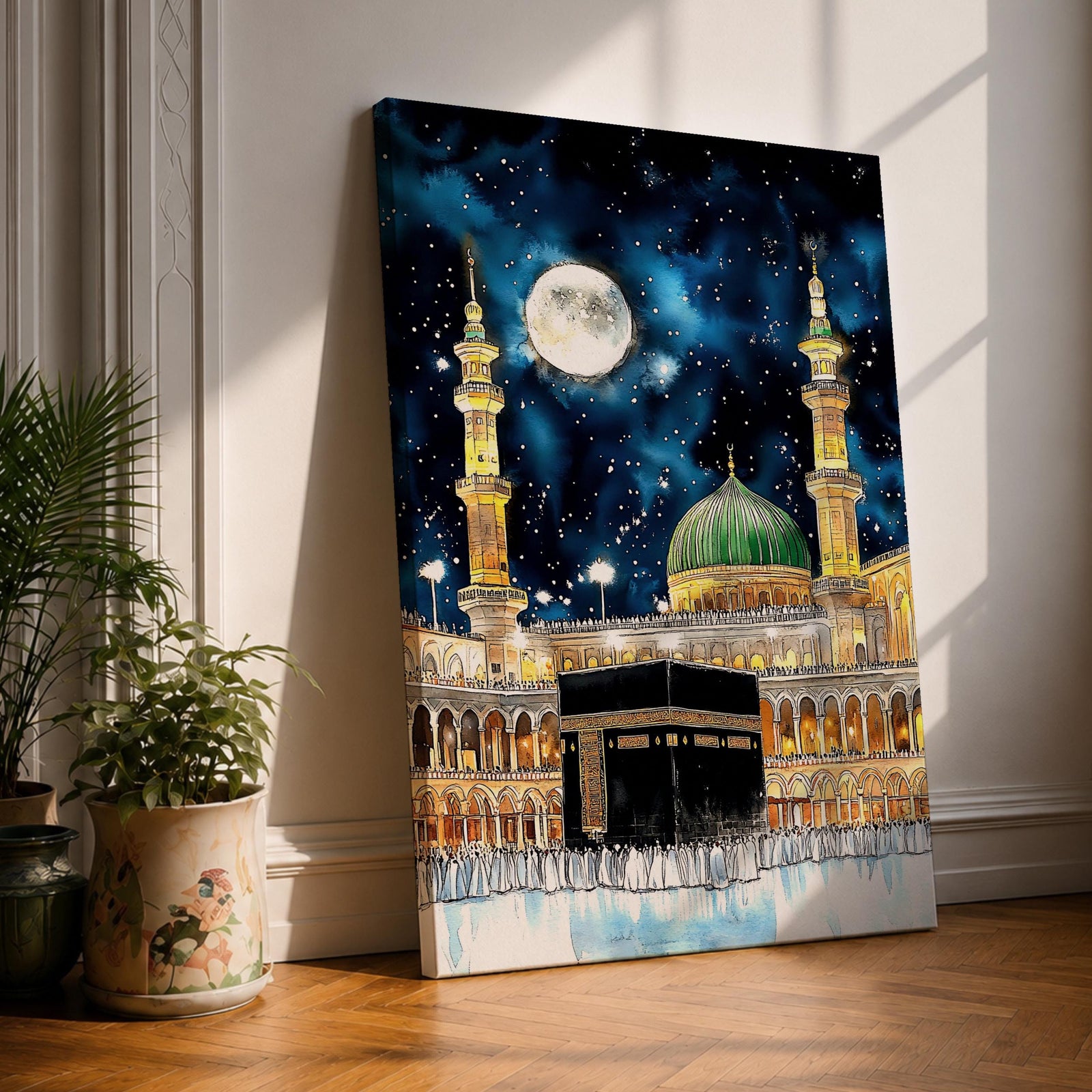 Painting of the Kaaba at Masjid Al Haram under a night sky filled with stars and a large full moon, surrounded by illuminated mosque arcades and tall minarets with pilgrims gathered around the sacred cube, while the green dome of Masjid Al Nabawi appears in the background within the composition.
