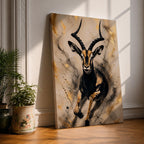 Striking gazelle wall art featuring a graceful antelope in motion with elegant curved horns against a contemporary abstract background. Wildlife artwork with dramatic black and gold tones, expressive splatter details, and luxurious gold accents, perfect for modern, safari, and nature-inspired interiors.