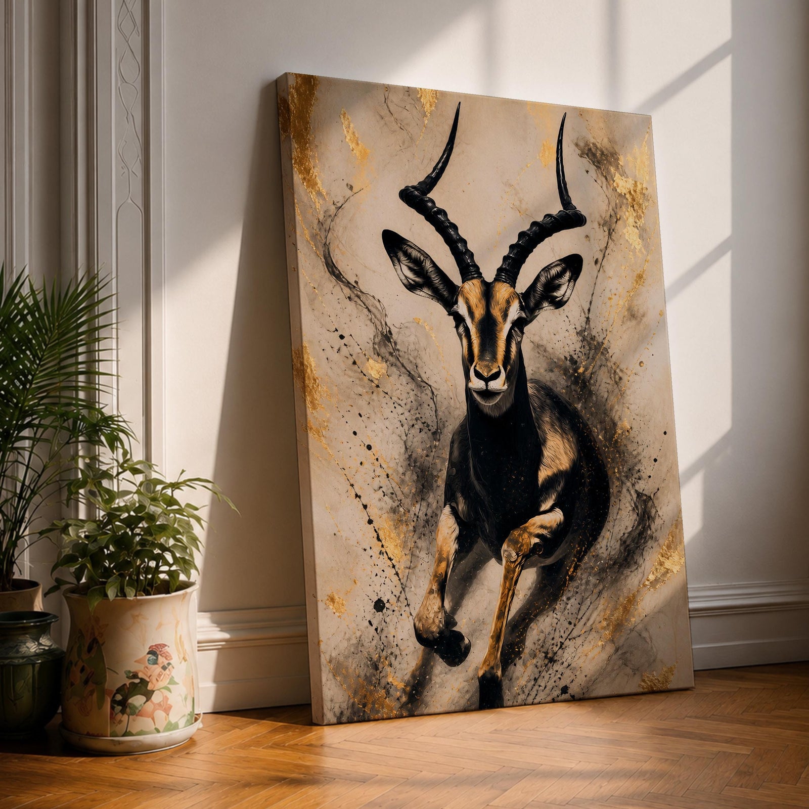 Striking gazelle wall art featuring a graceful antelope in motion with elegant curved horns against a contemporary abstract background. Wildlife artwork with dramatic black and gold tones, expressive splatter details, and luxurious gold accents, perfect for modern, safari, and nature-inspired interiors.