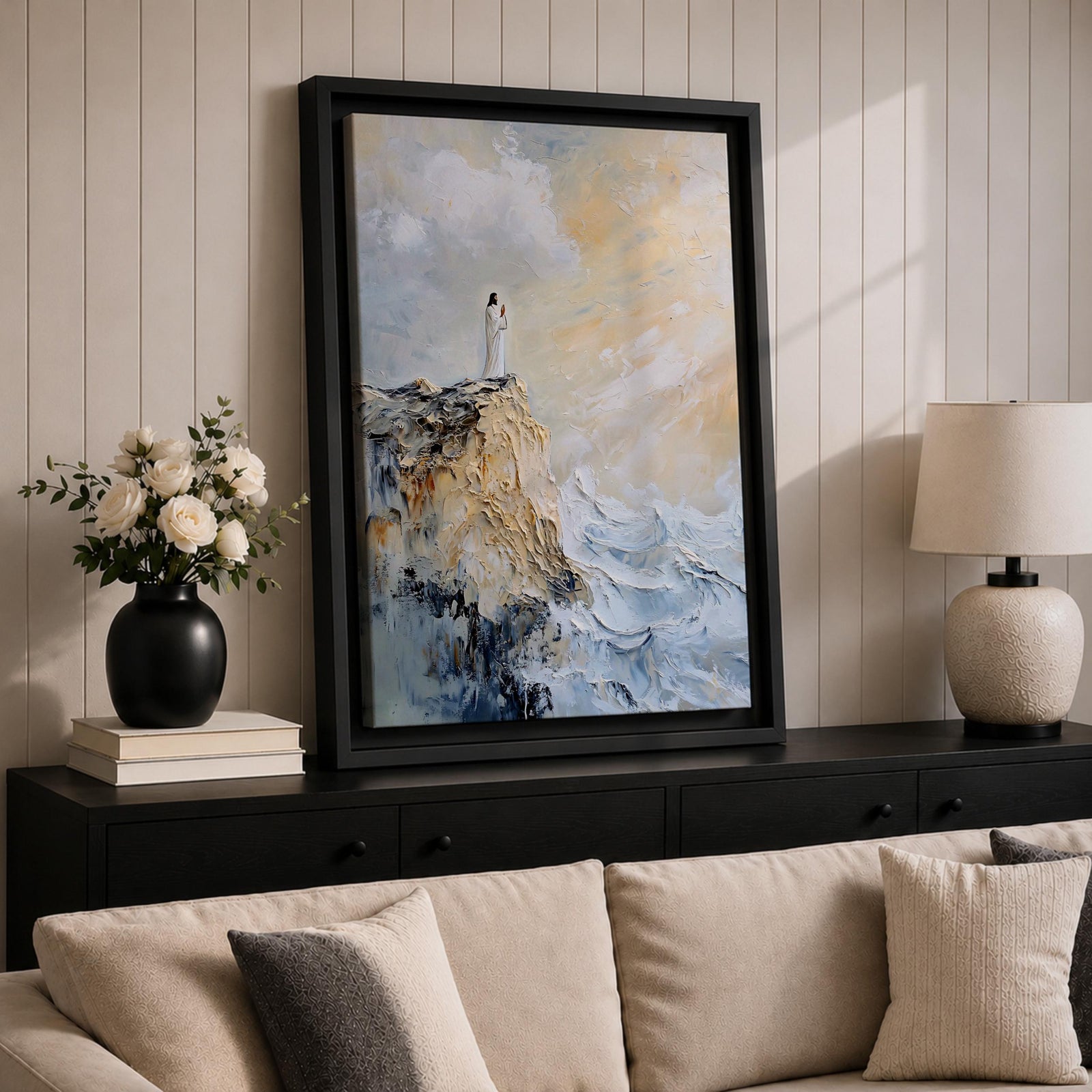 Impasto style painting of Jesus standing in prayer on the edge of a rocky seaside cliff, wearing a flowing white robe while waves crash below and soft light breaks through the clouds above, rendered with thick textured brushstrokes and a minimalist composition emphasizing a quiet devotional moment of Christ in prayer.