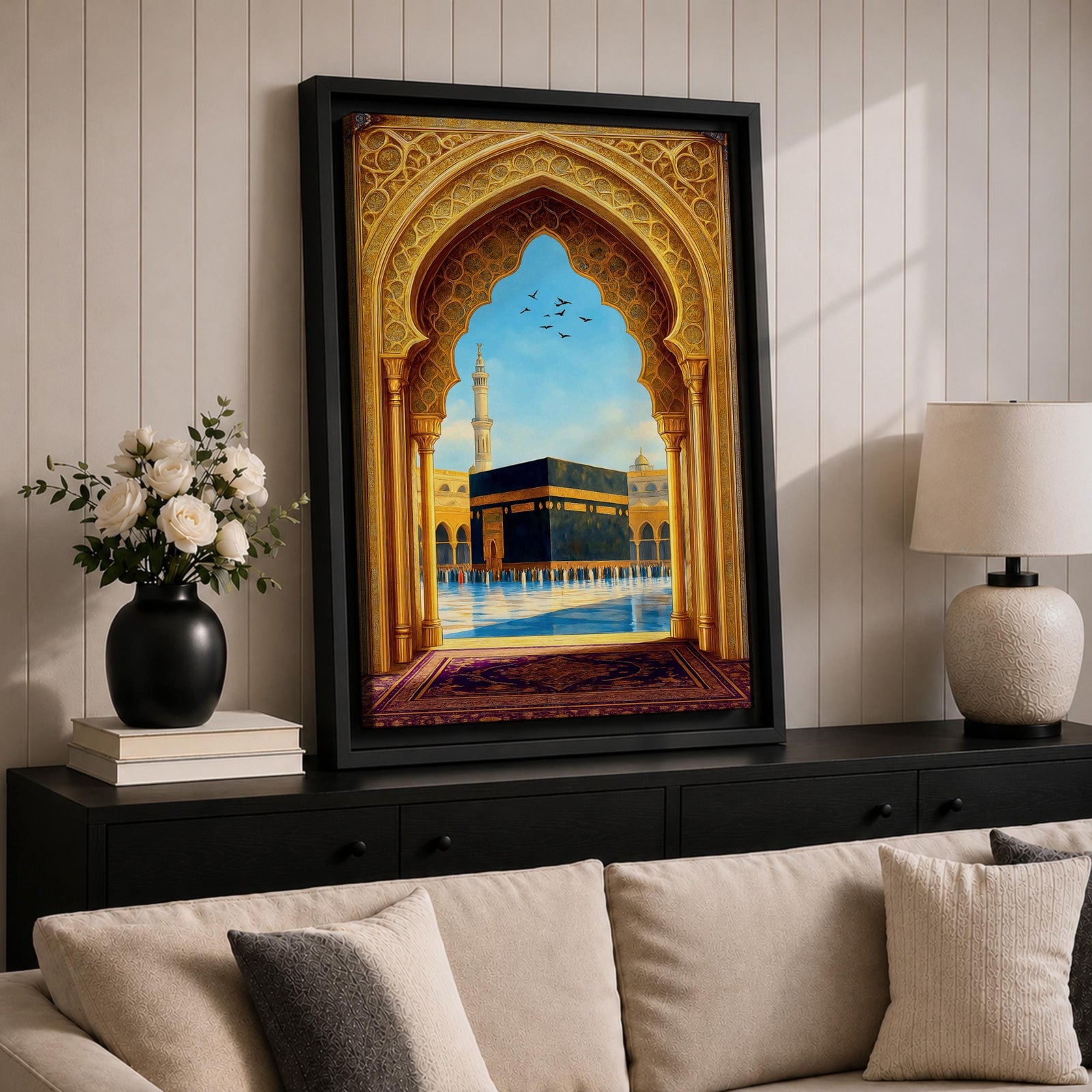Artwork of the Kaaba in Mecca viewed through an ornate golden Islamic archway with mosque minarets and birds above the reflective courtyard of Masjid Haram.