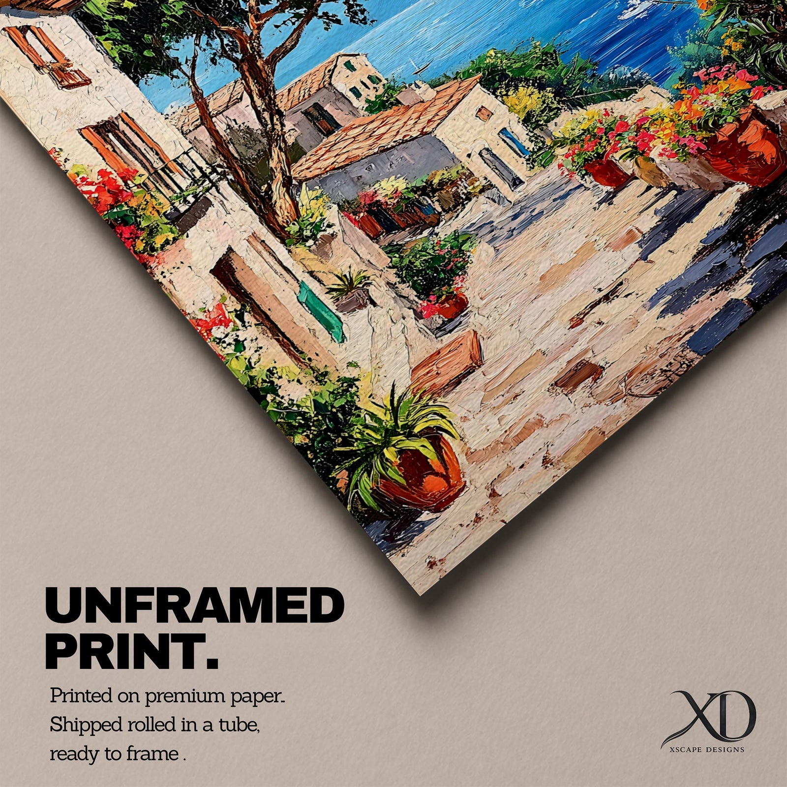 This artwork depicts a vibrant Italian village scene with terracotta-roofed houses, lush greenery, and colorful flowers lining a stone pathway that leads down to a bright blue Mediterranean sea with sailboats and distant mountains, rendered in a realistic style capturing coastal charm.