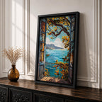 A framed canvas artwork depicting a Mediterranean balcony opening onto a vibrant coastal ocean view with sailboats on the water and leafy branches framing the scene. The style is realistic with bold, clear lines and vivid colors emphasizing the natural landscape and architectural elements.