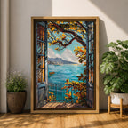 A framed canvas artwork depicting a Mediterranean balcony opening onto a vibrant coastal ocean view with sailboats on the water and leafy branches framing the scene. The style is realistic with bold, clear lines and vivid colors emphasizing the natural landscape and architectural elements.