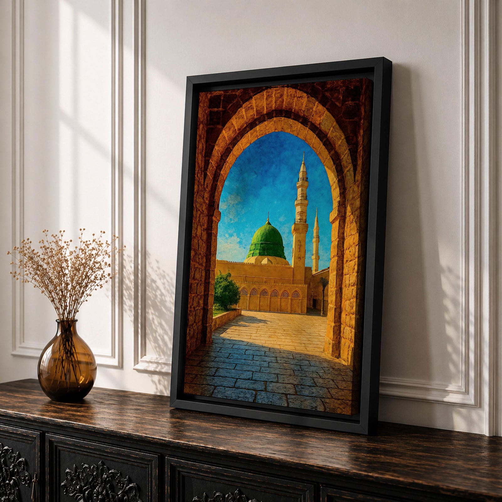 Artwork of Masjid Al Nabawi in Medina viewed through a historic stone archway with the iconic green dome and tall mosque minarets rising under a bright blue sky.