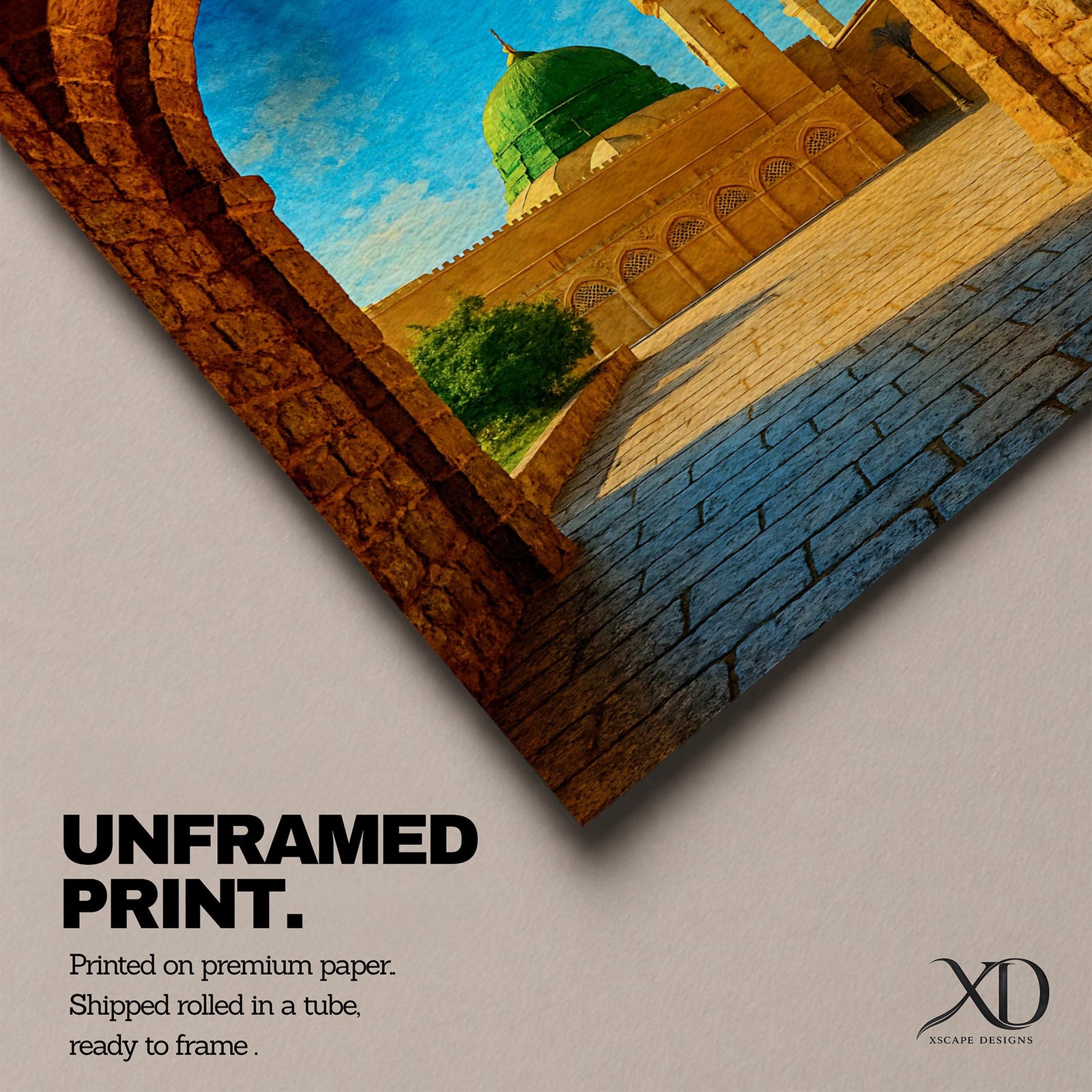 Artwork of Masjid Al Nabawi in Medina viewed through a historic stone archway with the iconic green dome and tall mosque minarets rising under a bright blue sky.