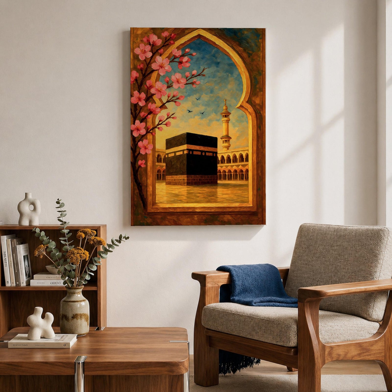 Textured oil painting of the Kaaba in Masjid Haram framed by a decorative Islamic archway with blooming pink flowers, a mosque minaret in the background, and warm sunset tones over the courtyard.