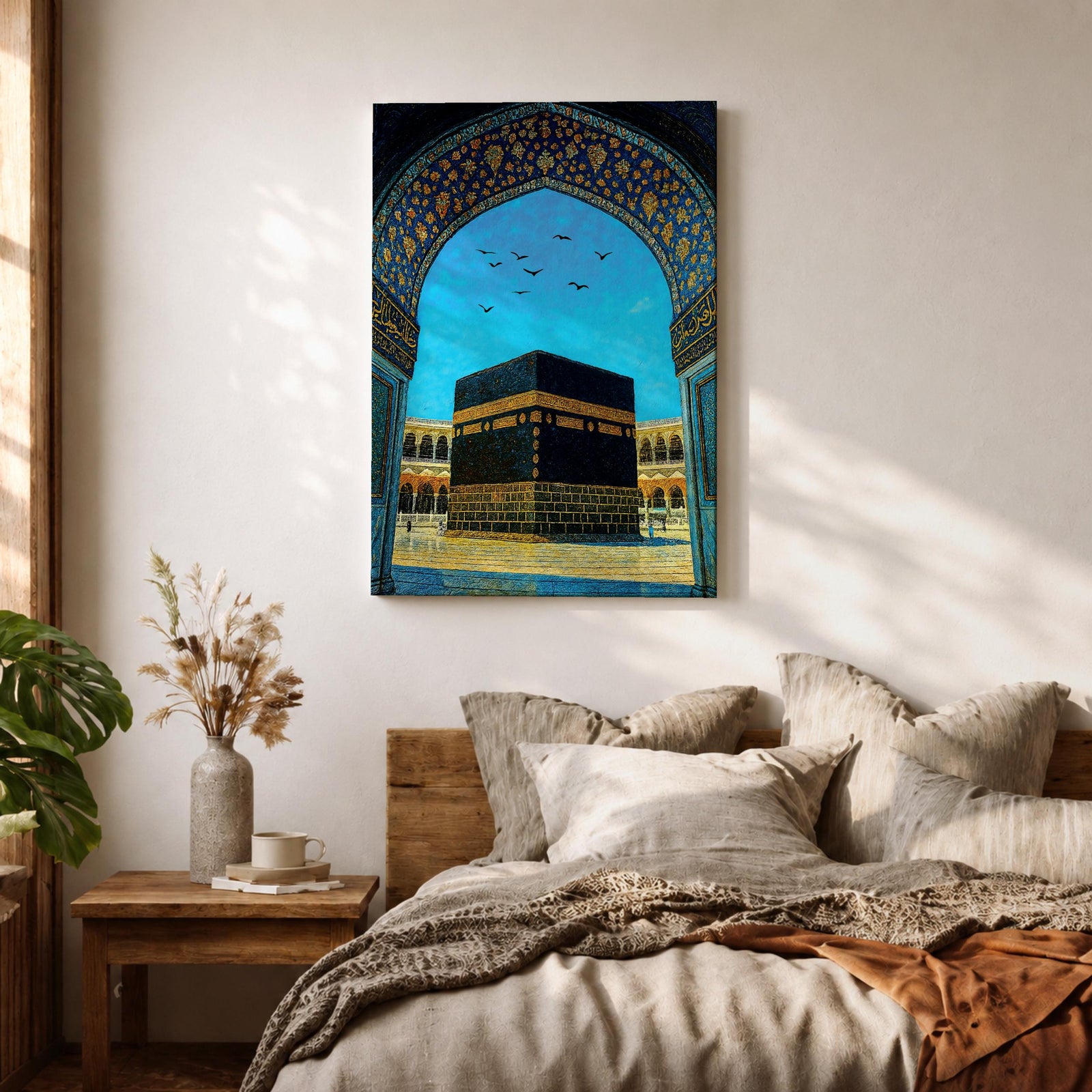 Artwork of the Kaaba in Masjid Haram framed by an ornate Moorish arabesque archway with intricate blue and gold patterns and birds flying across a bright sky above the mosque courtyard.