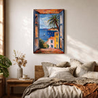A framed canvas artwork depicting a coastal window view overlooking a Mediterranean ocean scene with sailboats on blue water, colorful buildings with terracotta roofs, and a palm tree, rendered in a realistic style capturing the serene seaside landscape.