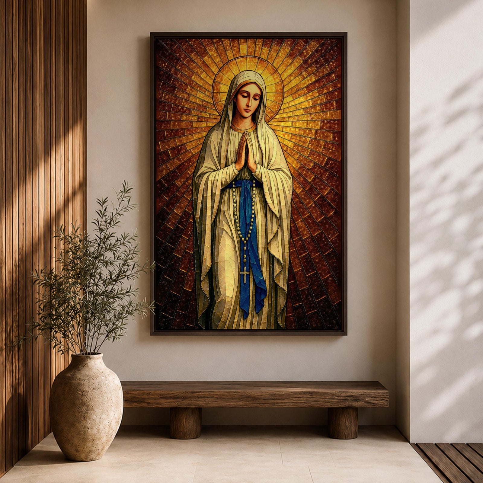 A stained glass style artwork depicting Our Lady of Fatima standing with hands clasped in prayer, wearing a flowing robe and a blue sash with rosary beads. The background features radiant golden mosaic tiles arranged in a halo pattern emphasizing the figure’s serene expression and sacred presence.