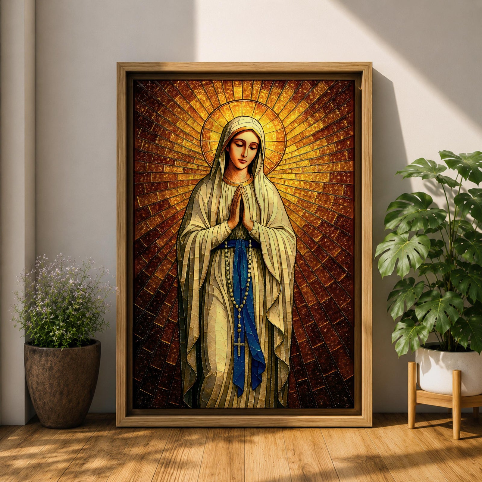 A stained glass style artwork depicting Our Lady of Fatima standing with hands clasped in prayer, wearing a flowing robe and a blue sash with rosary beads. The background features radiant golden mosaic tiles arranged in a halo pattern emphasizing the figure’s serene expression and sacred presence.