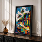 A vibrant painting of a Caribbean village featuring colorful houses along a waterfront with two boats docked near the shore and tall palm trees under a bright sky. The style is bold and lively with strong brushstrokes and vivid colors, capturing a tropical coastal landscape scene.