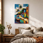 A vibrant painting of a Caribbean village featuring colorful houses along a waterfront with two boats docked near the shore and tall palm trees under a bright sky. The style is bold and lively with strong brushstrokes and vivid colors, capturing a tropical coastal landscape scene.