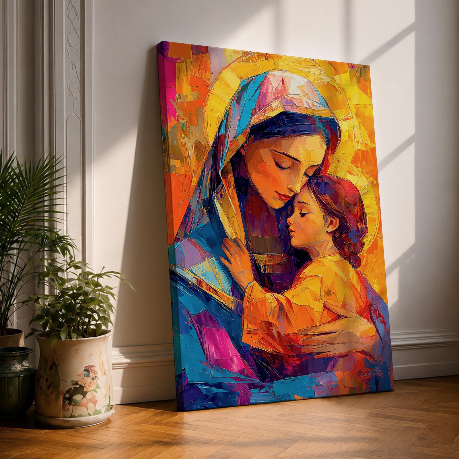 Vibrant mosaic style painting of Mary and Child showing the Virgin Mary gently embracing baby Jesus with both surrounded by glowing golden halos, rendered with bold geometric brushstrokes in bright blues, oranges, reds, and yellows forming a colorful devotional Christian portrait.
