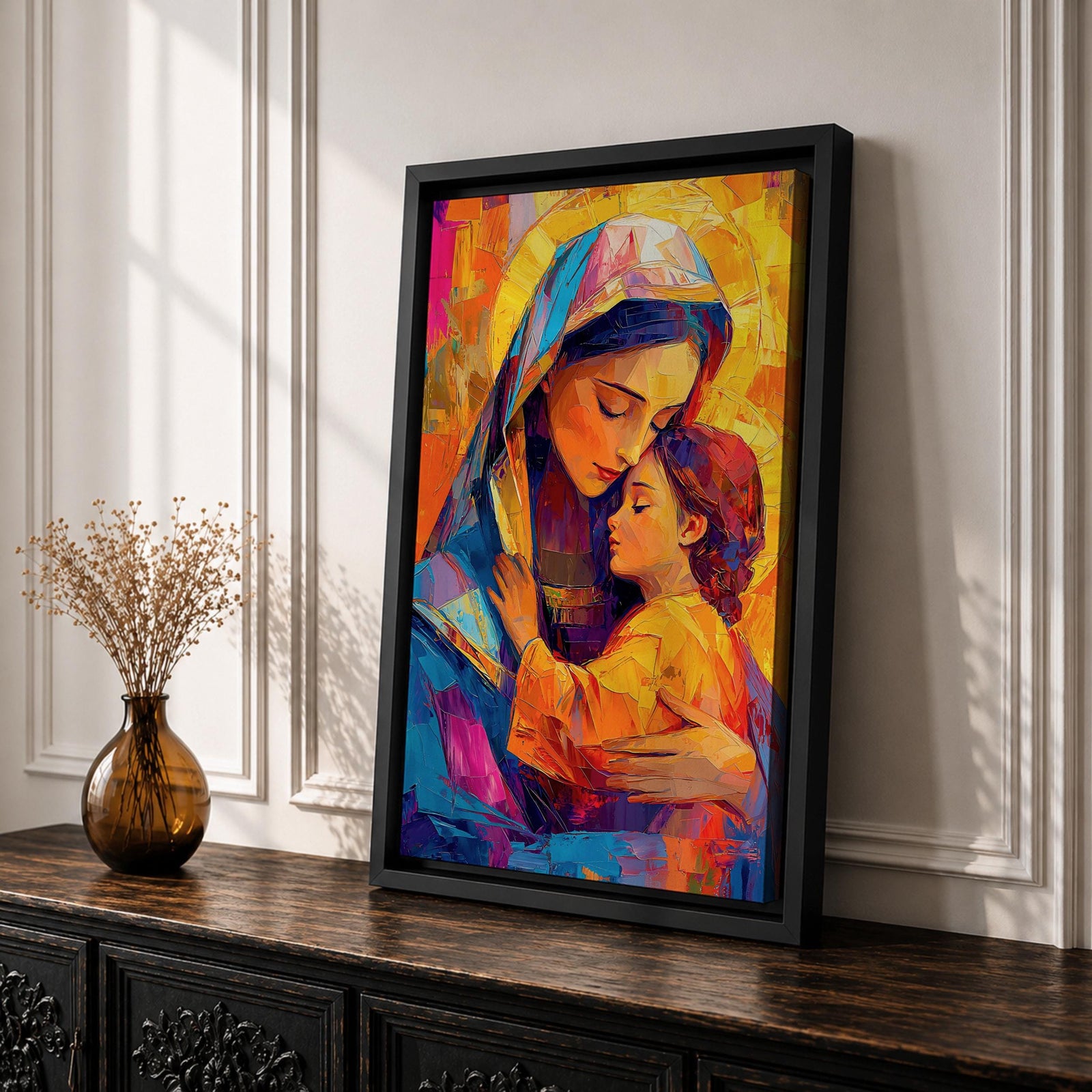 Vibrant mosaic style painting of Mary and Child showing the Virgin Mary gently embracing baby Jesus with both surrounded by glowing golden halos, rendered with bold geometric brushstrokes in bright blues, oranges, reds, and yellows forming a colorful devotional Christian portrait.