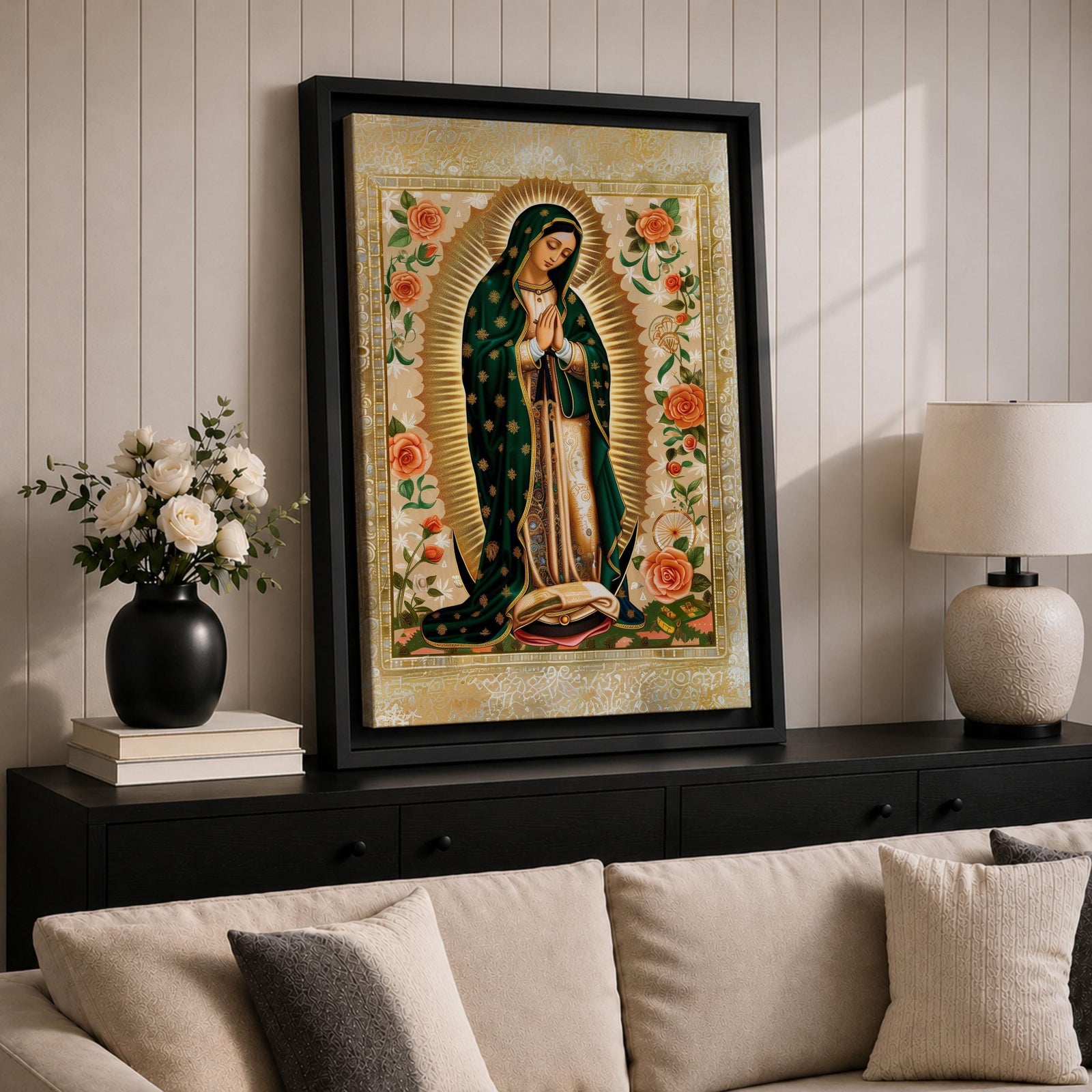 Decorative devotional illustration of Our Lady of Guadalupe standing in prayer with hands folded, wearing a green mantle with golden stars and a pink robe, surrounded by radiant golden rays and an ornate border of blooming roses and floral motifs in a traditional Mexican Catholic icon style.