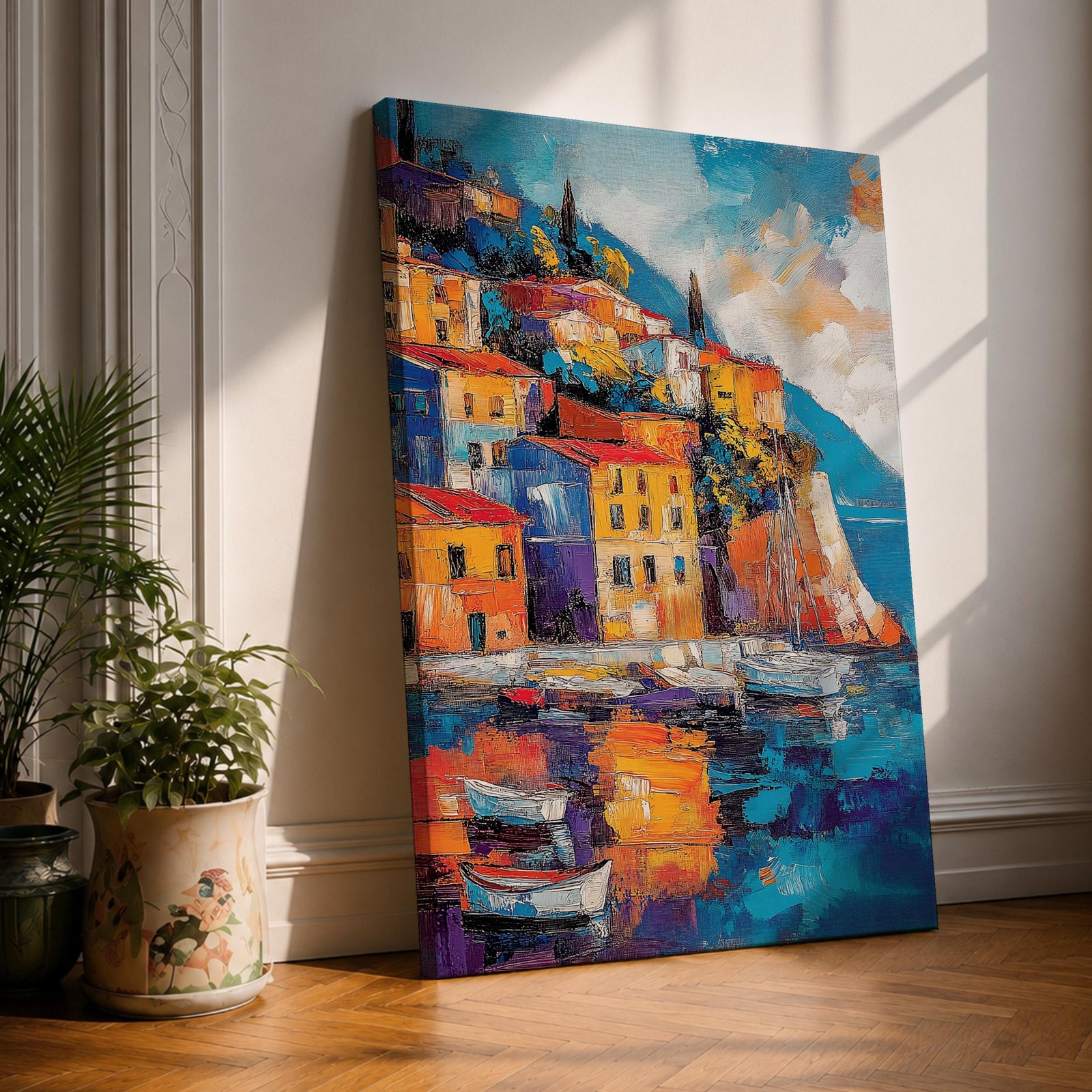 This impasto style framed canvas depicts a vibrant Italian village perched on a coastal hillside with colorful buildings and boats reflected in the water, capturing the Mediterranean landscape with textured brushstrokes and bold colors.