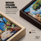 A vibrant framed canvas painting depicting a charming coastal village with stone-paved streets, terracotta rooftops, lush greenery, colorful flowers, and sailboats on a deep blue sea under a clear sky, rendered in a detailed, realistic style capturing Mediterranean summer ambiance.