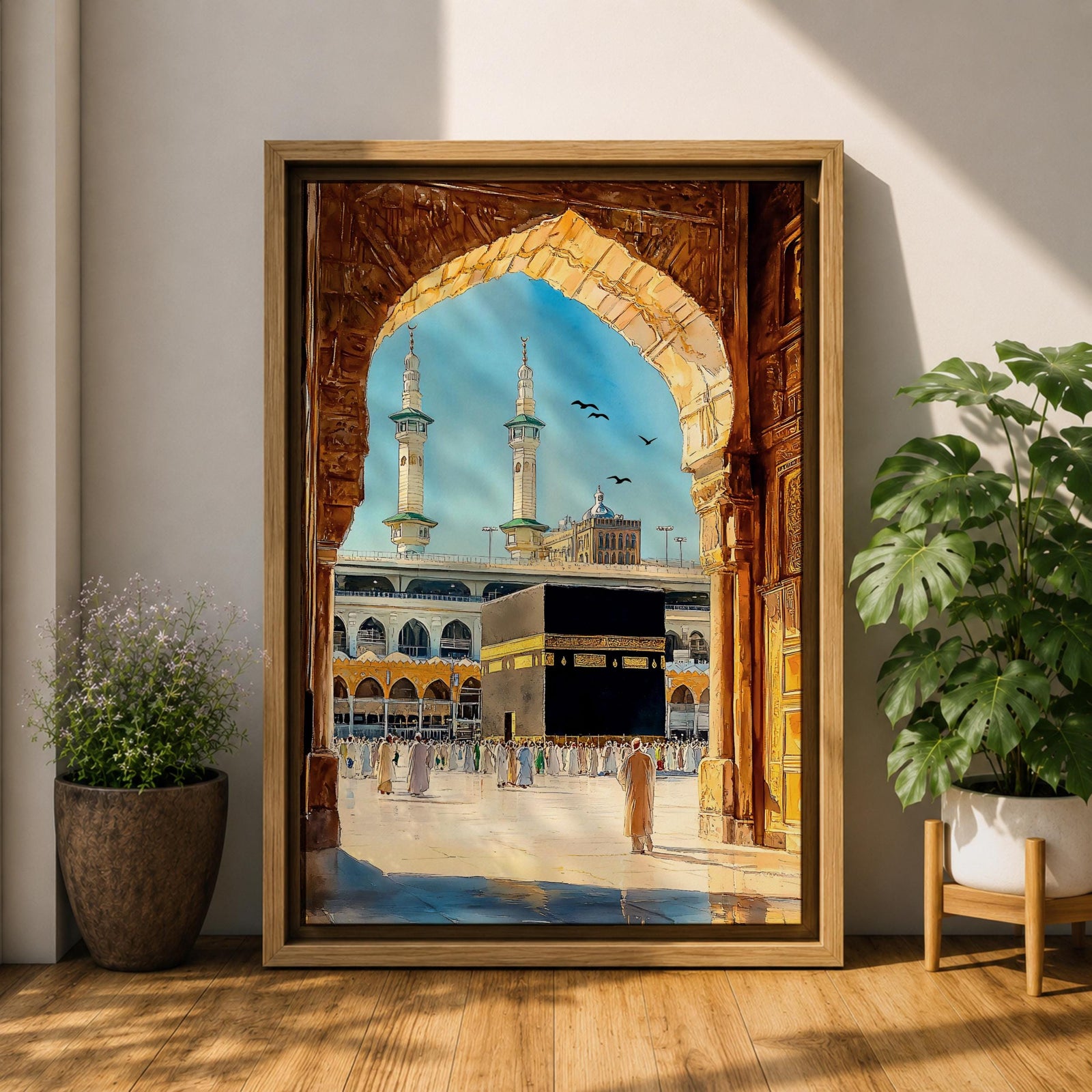 Watercolor style artwork showing the Kaaba at Masjid Al Haram in Mecca framed through a large golden mosque arch, with pilgrims gathered around the courtyard and two tall minarets rising against a clear blue sky.