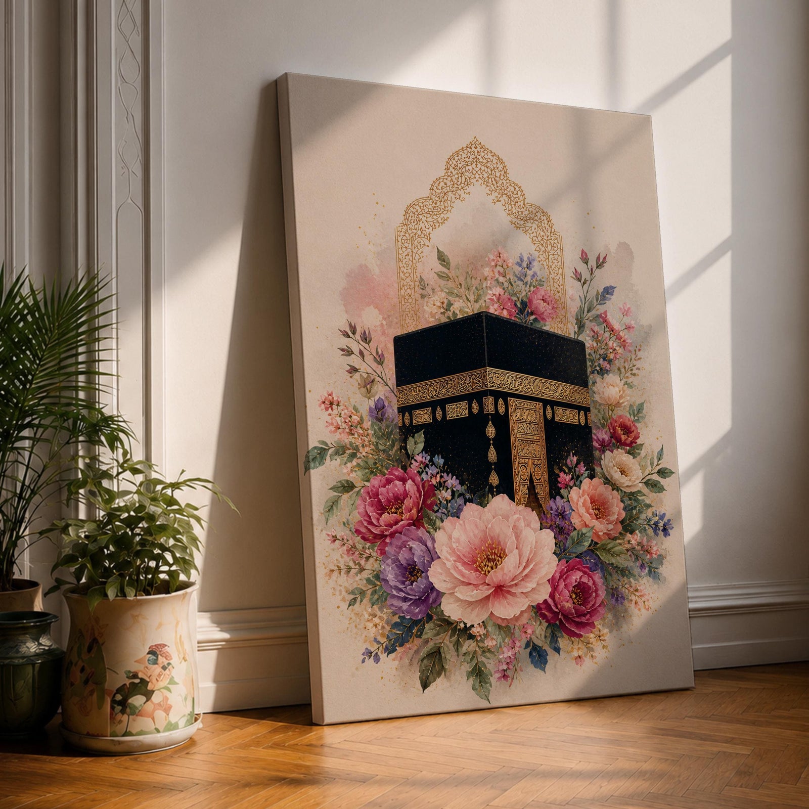 Elegant Kaaba wall art featuring the Holy Kaaba surrounded by blooming pink, blush, purple, and ivory flowers with delicate Islamic arch details. Soft watercolor tones and gold accents create a beautiful Islamic canvas artwork perfect for prayer rooms, bedrooms, and Muslim home decor.