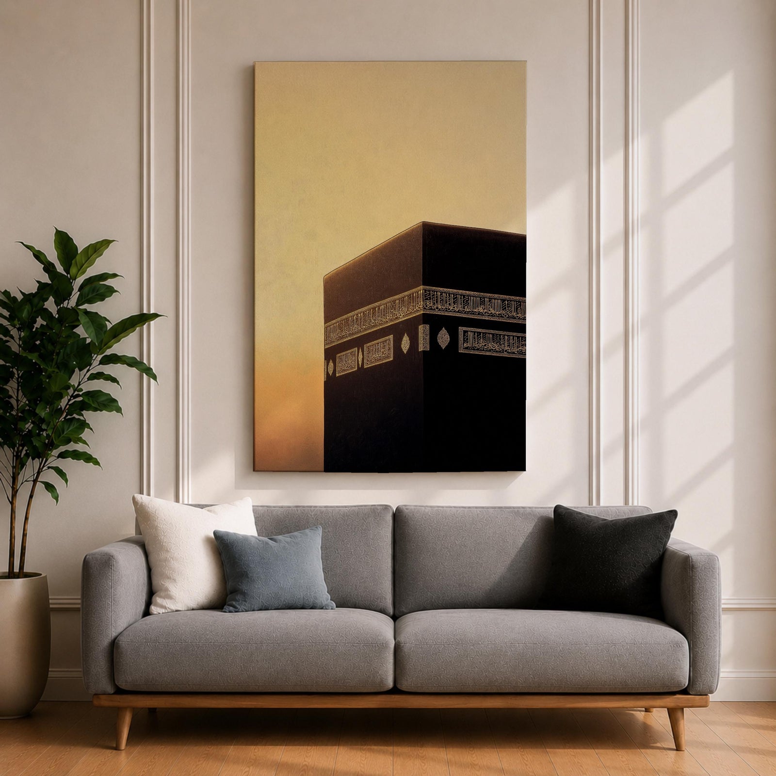 Minimalist artwork of the Kaaba at Masjid Al Haram in Mecca showing the black cubic shrine with gold calligraphy bands against a dramatic golden sunset sky and soft clouds.