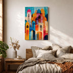 Colorful abstract artwork featuring layered mosque domes, arches, and minarets in vibrant blue, orange, red, and yellow tones, forming a stylized Islamic architectural skyline.