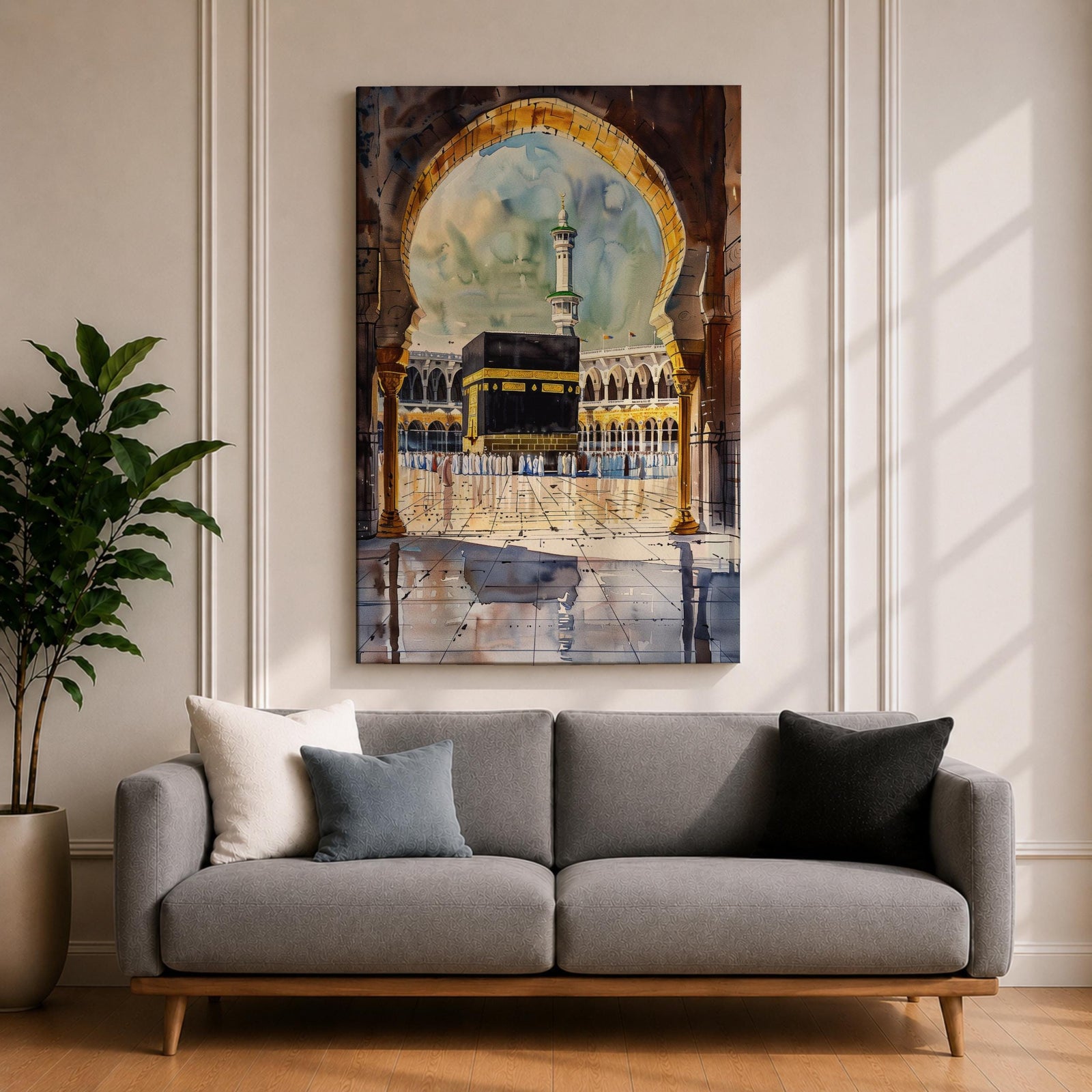 Watercolor-style painting of the Kaaba at Masjid Al Haram in Mecca viewed through a large mosque archway, with pilgrims standing in the courtyard and a tall minaret rising behind the sacred shrine.
