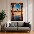 Artwork of Masjid Al Nabawi in Medina showing the iconic green dome and tall minarets framed through a large stone archway with a reflective marble courtyard under a bright blue sky.