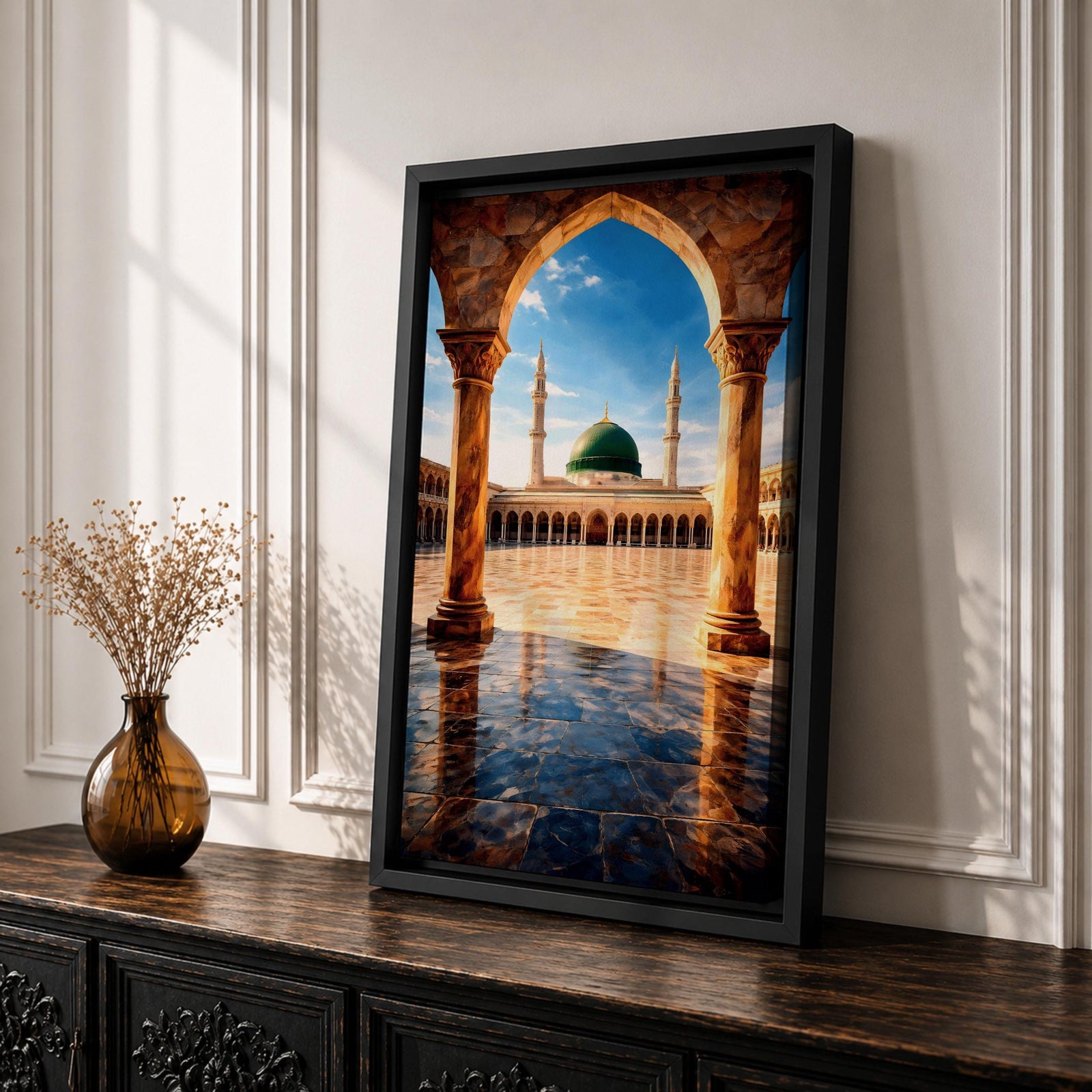 Artwork of Masjid Al Nabawi in Medina showing the iconic green dome and tall minarets framed through a large stone archway with a reflective marble courtyard under a bright blue sky.