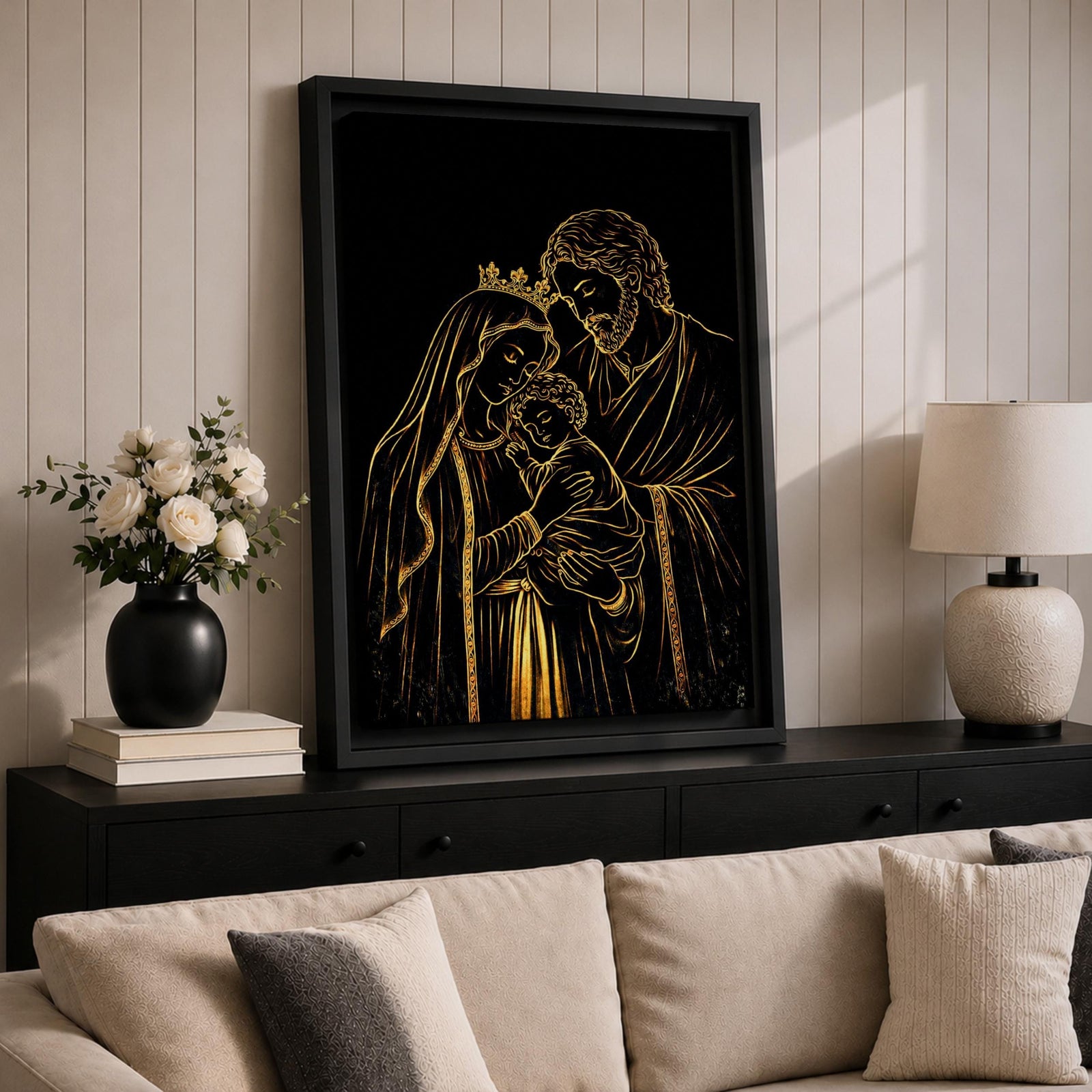 Elegant gold line illustration of the Holy Family showing Mary, Joseph, and baby Jesus embraced together, drawn in glowing gold lines on a deep black background creating a minimalist Catholic devotional artwork.