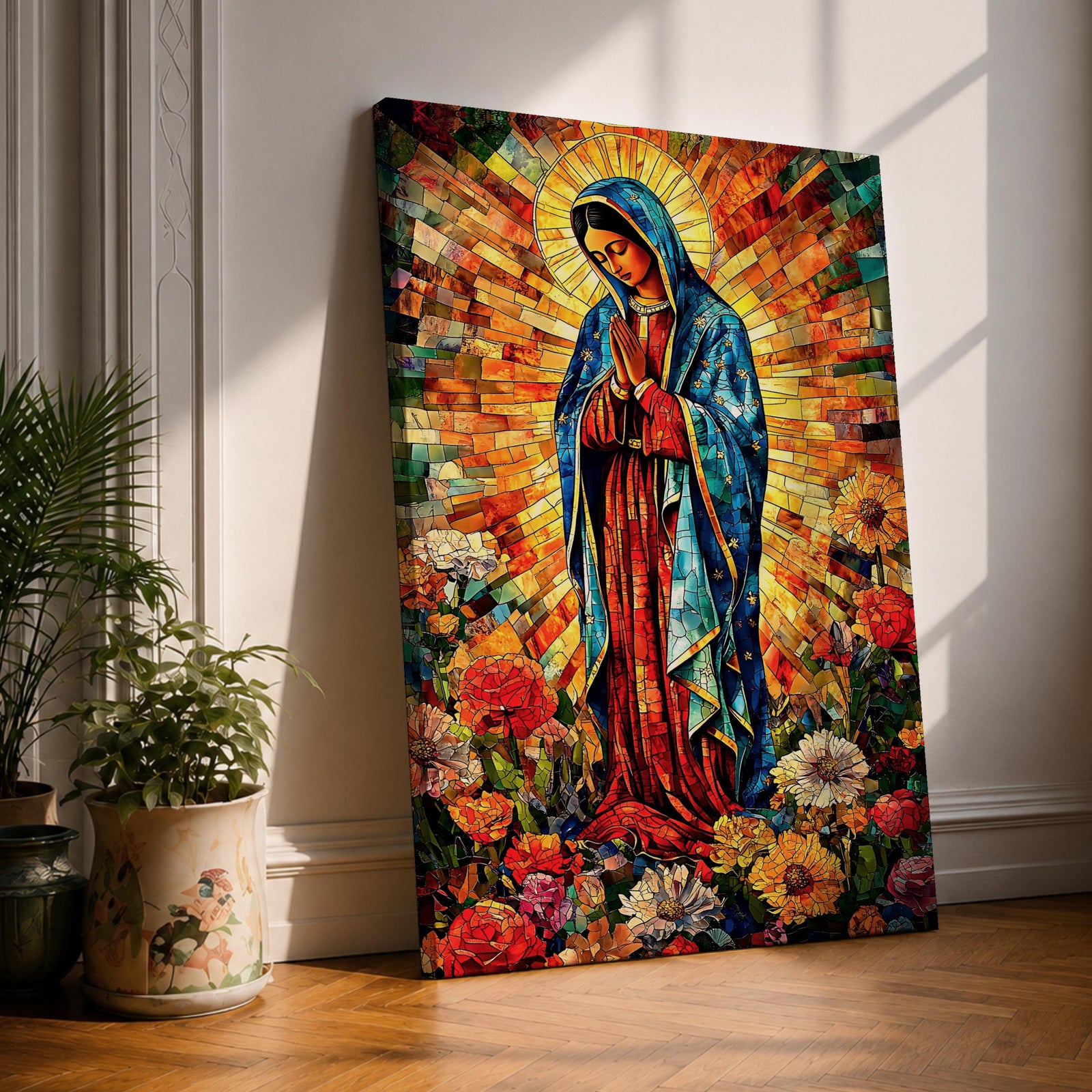 Colorful devotional painting of Our Lady of Guadalupe standing in prayer with hands folded, wearing a blue mantle and surrounded by a radiant golden halo and vibrant flowers in a rich Mexican Catholic devotional style.