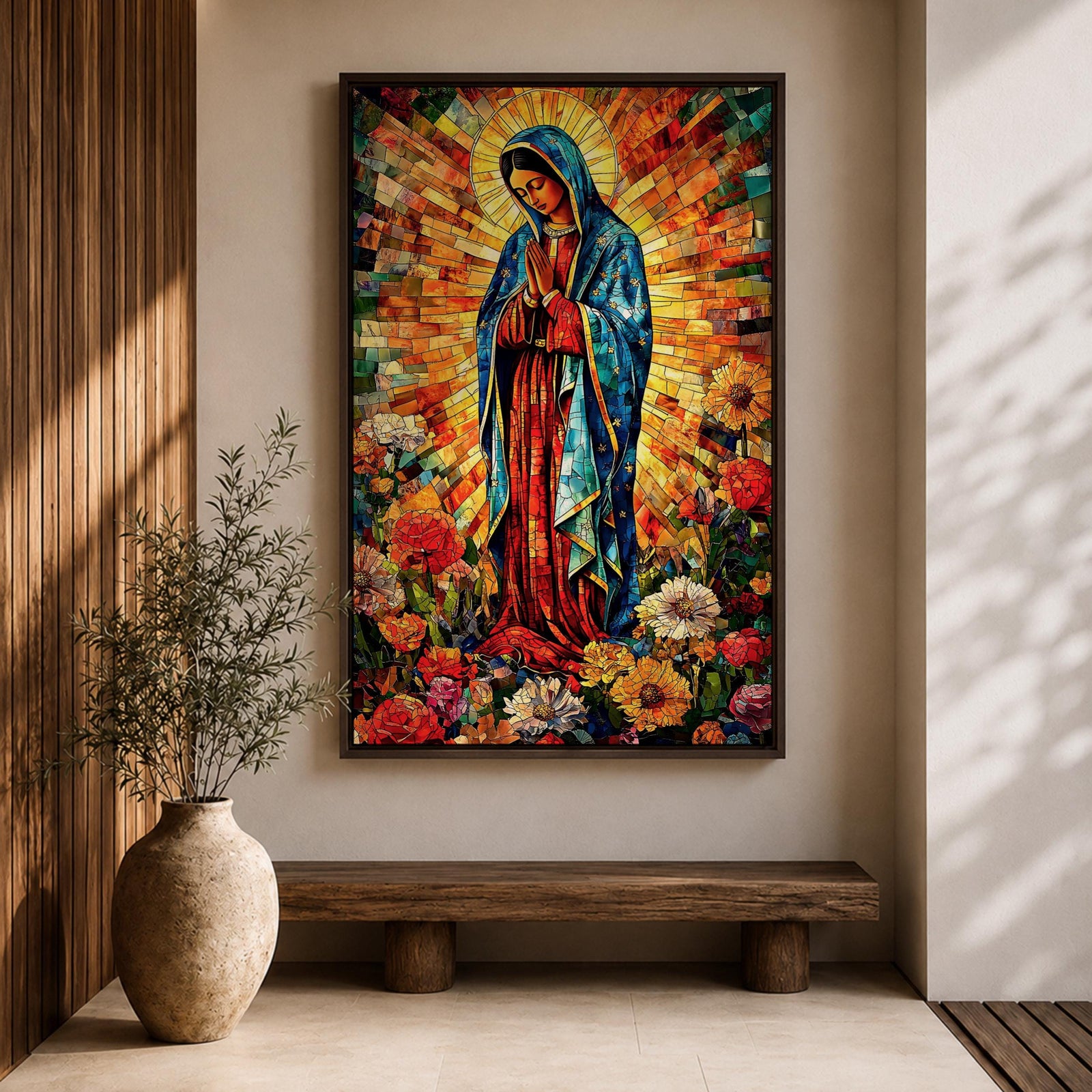 Colorful devotional painting of Our Lady of Guadalupe standing in prayer with hands folded, wearing a blue mantle and surrounded by a radiant golden halo and vibrant flowers in a rich Mexican Catholic devotional style.