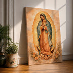 Painting of Our Lady of Guadalupe standing in a prayer pose with hands clasped and head bowed, wearing a flowing rose colored gown and a blue mantle decorated with stars, surrounded by radiant golden rays forming an oval halo, standing on a crescent moon supported by a small angel in traditional Catholic devotional style.