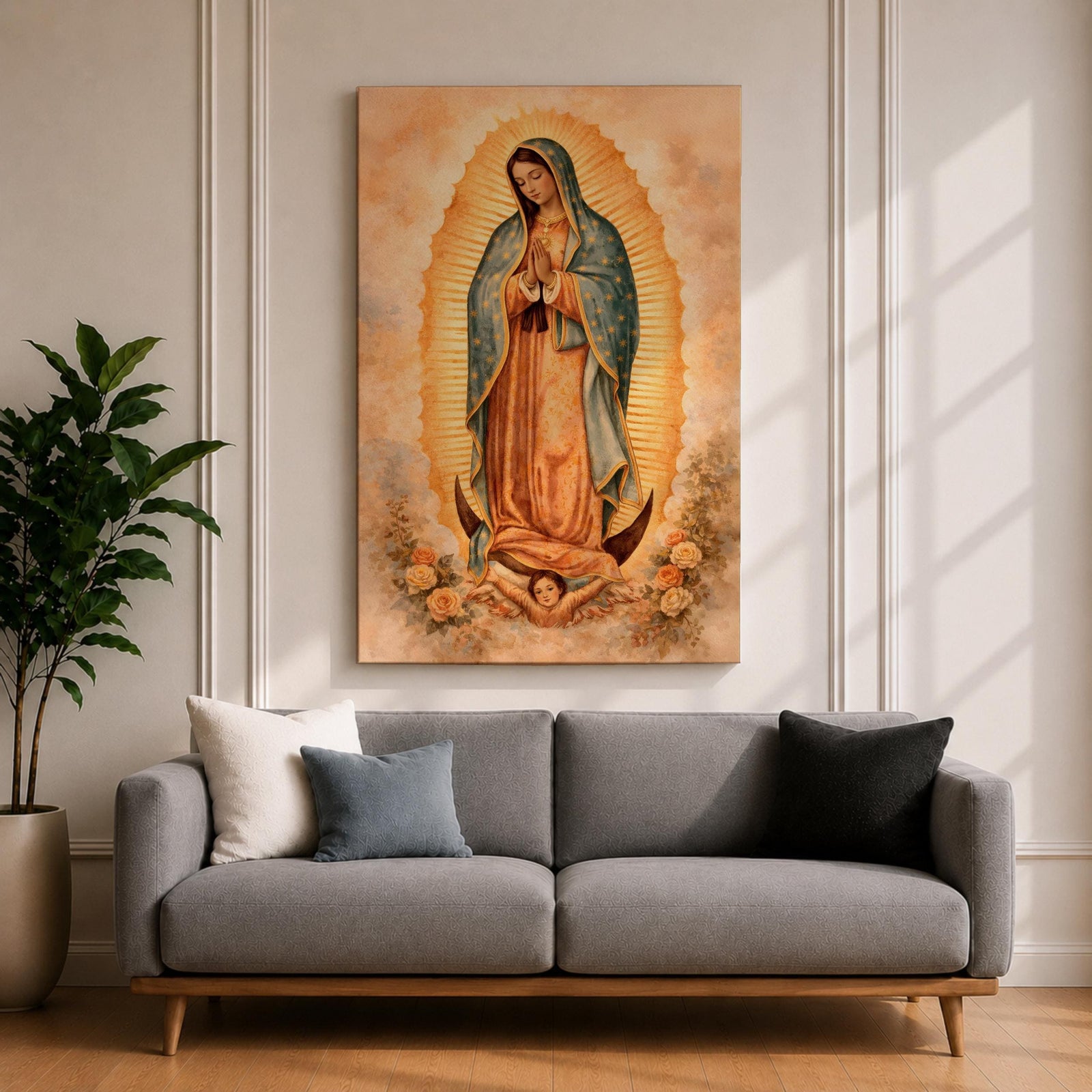 Painting of Our Lady of Guadalupe standing in a prayer pose with hands clasped and head bowed, wearing a flowing rose colored gown and a blue mantle decorated with stars, surrounded by radiant golden rays forming an oval halo, standing on a crescent moon supported by a small angel in traditional Catholic devotional style.