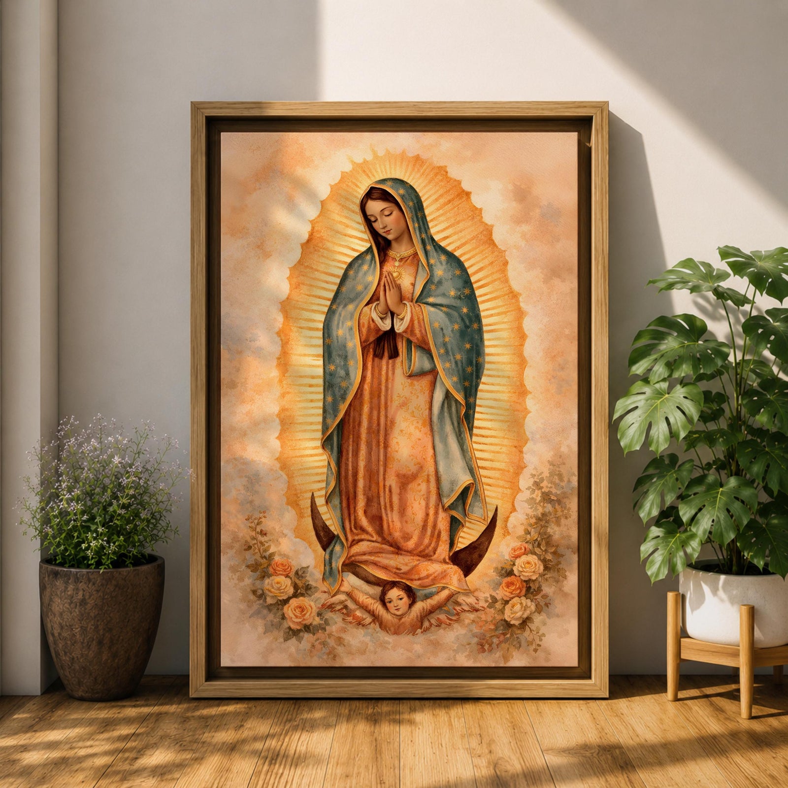 Painting of Our Lady of Guadalupe standing in a prayer pose with hands clasped and head bowed, wearing a flowing rose colored gown and a blue mantle decorated with stars, surrounded by radiant golden rays forming an oval halo, standing on a crescent moon supported by a small angel in traditional Catholic devotional style.