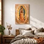 Painting of Our Lady of Guadalupe standing in a prayer pose with hands clasped and head bowed, wearing a flowing rose colored gown and a blue mantle decorated with stars, surrounded by radiant golden rays forming an oval halo, standing on a crescent moon supported by a small angel in traditional Catholic devotional style.