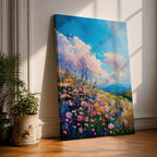 A vibrant impasto painting of a wildflower meadow featuring dense clusters of colorful flowers under a bright blue sky with fluffy clouds. The textured brushstrokes create depth and movement, capturing a lively natural landscape scene with rolling hills in the distance.