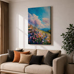 A vibrant impasto painting of a wildflower meadow featuring dense clusters of colorful flowers under a bright blue sky with fluffy clouds. The textured brushstrokes create depth and movement, capturing a lively natural landscape scene with rolling hills in the distance.